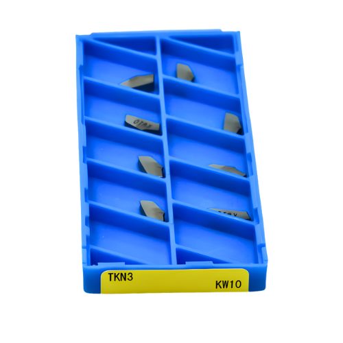 Top-down view of 10 Kyocera TKN3 KW10 cut-off inserts arranged in a tray for aluminium machining